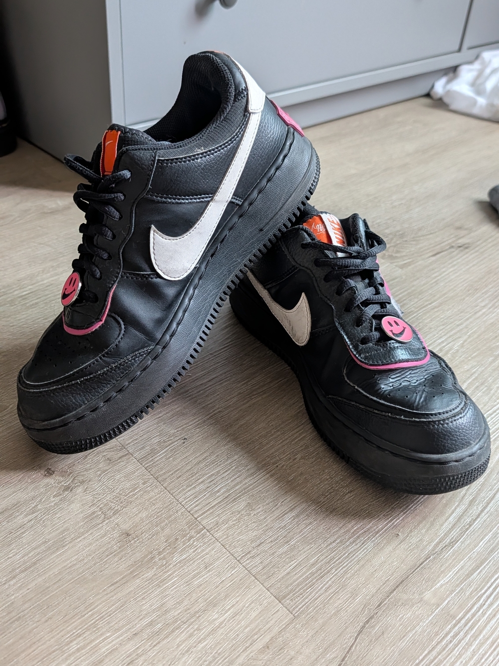 Nike Black Sneakers with White Swoosh and Pink Accents